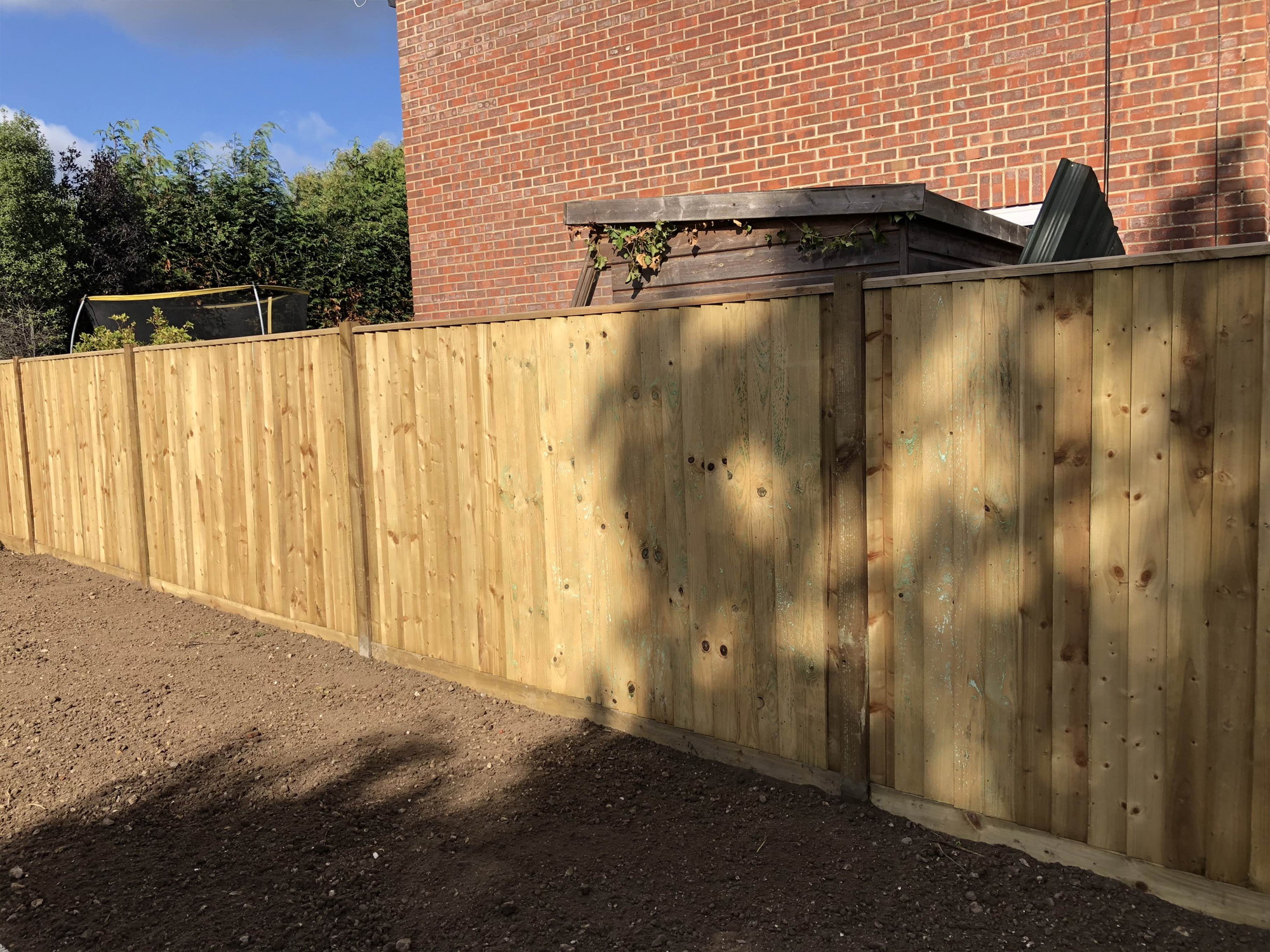 Wooden panel garden fence by North Oaks Fencing in Hampshire