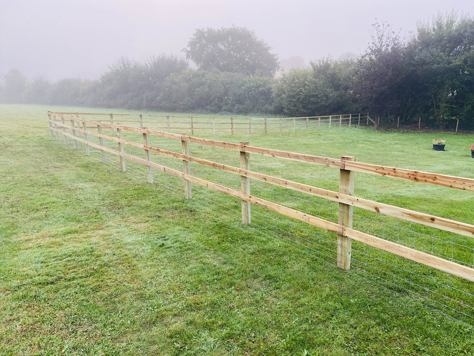 Livestock wood and wire fence by North Oaks Fencing in Hampshire