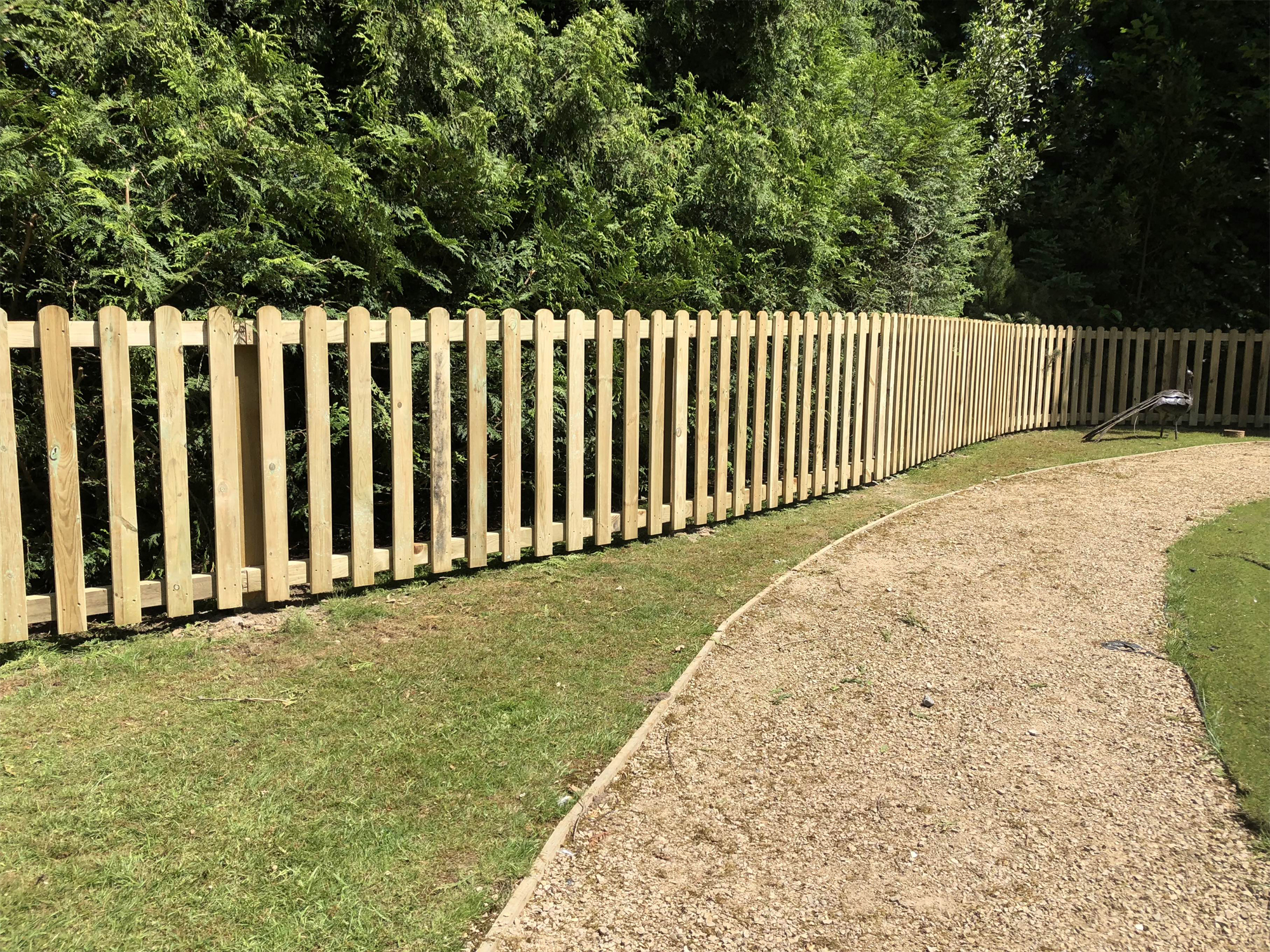 Wooden picket fence for a back garden by North Oaks Fencing in Hampshire